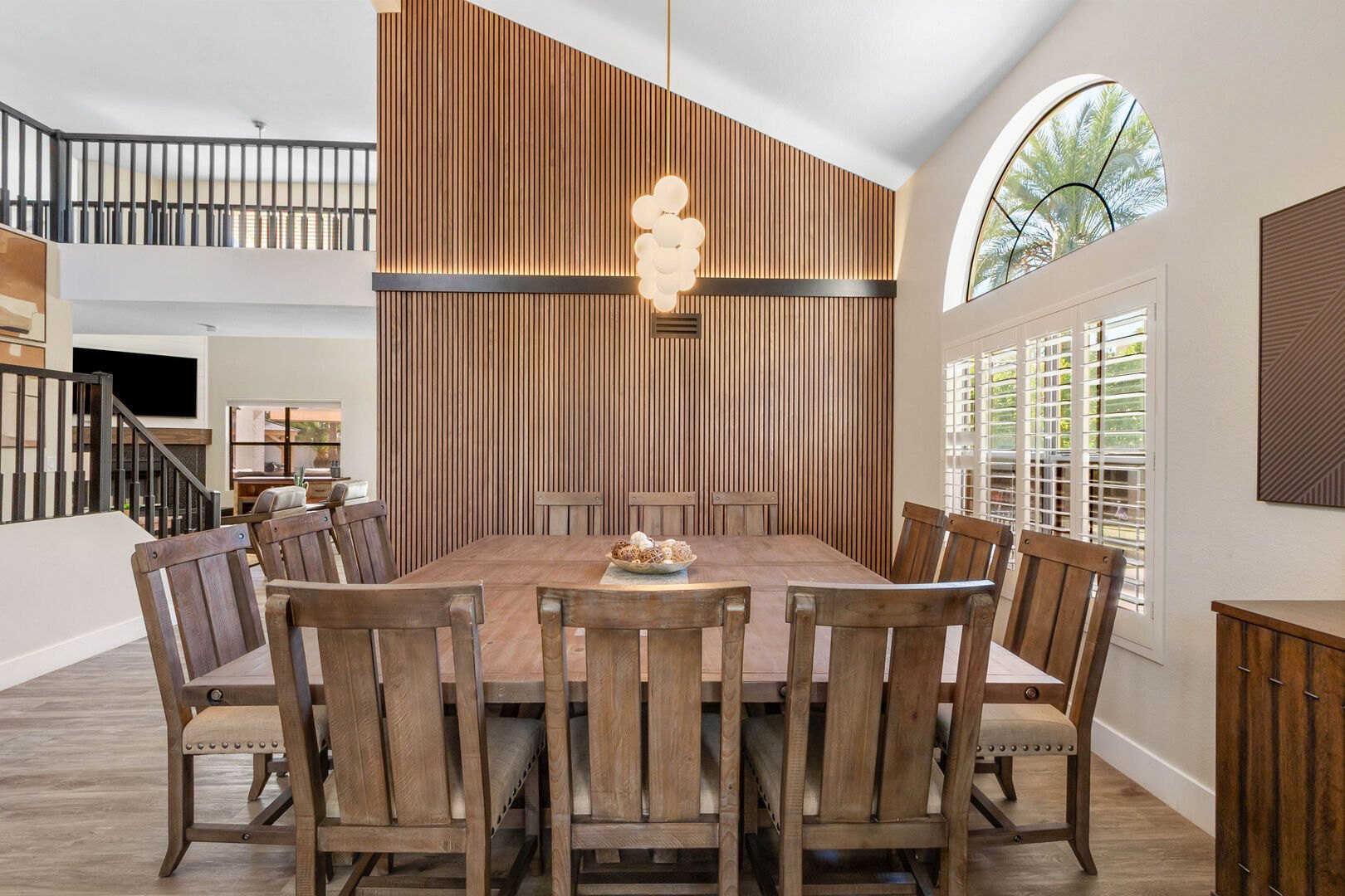 Remodeled dining room beside the kitchen with wood-slat feature wall