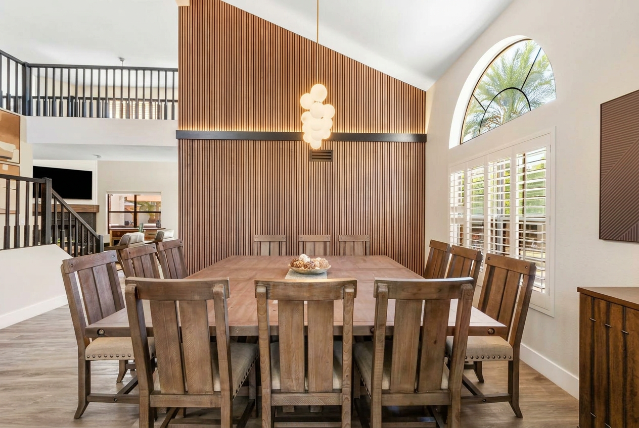Custom remodeling project featuring a vaulted dining room with wood-slat accent wall
